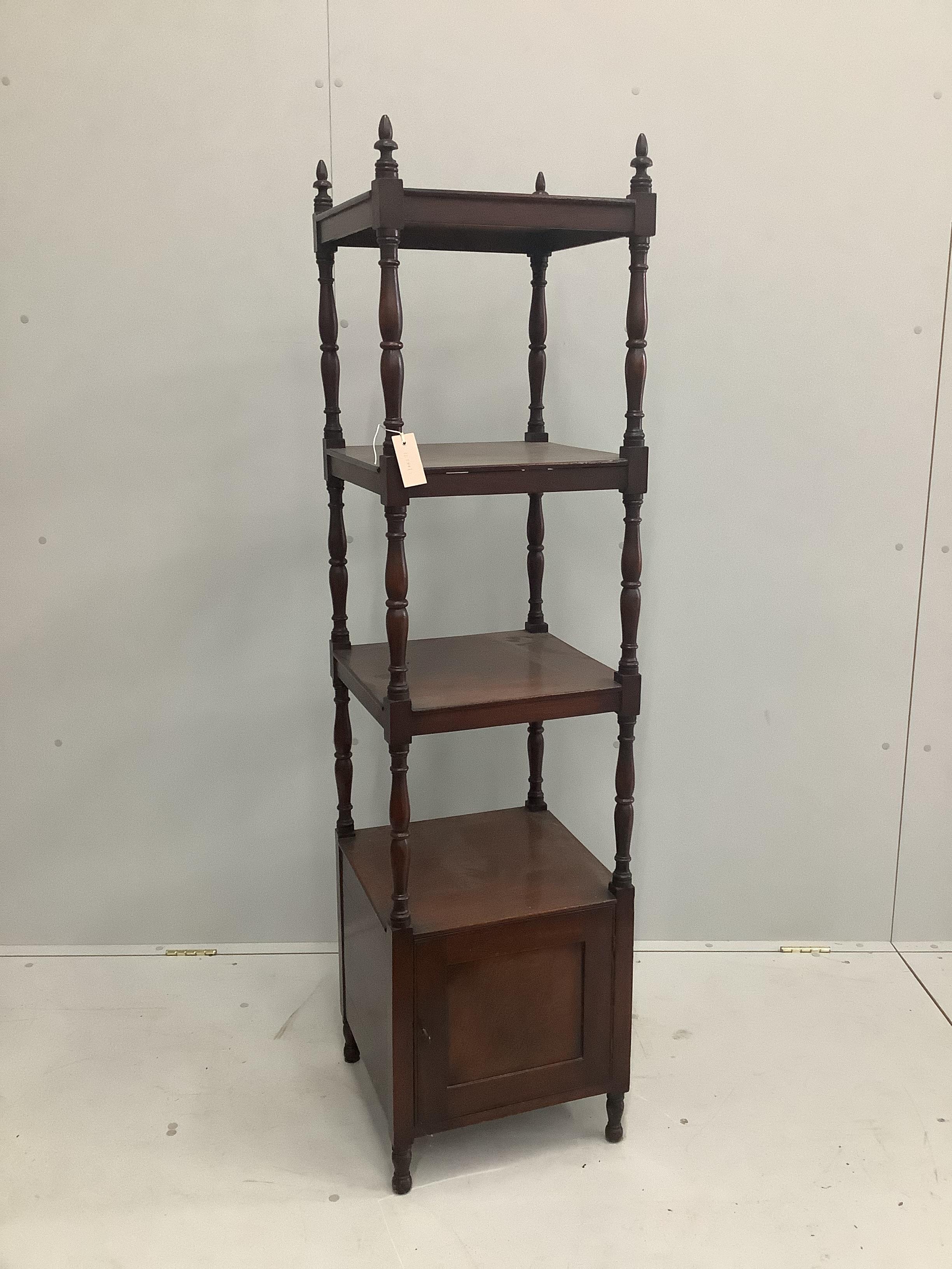 A Regency mahogany whatnot of slender proportions with base cupboard, width 40cm, height 156cm